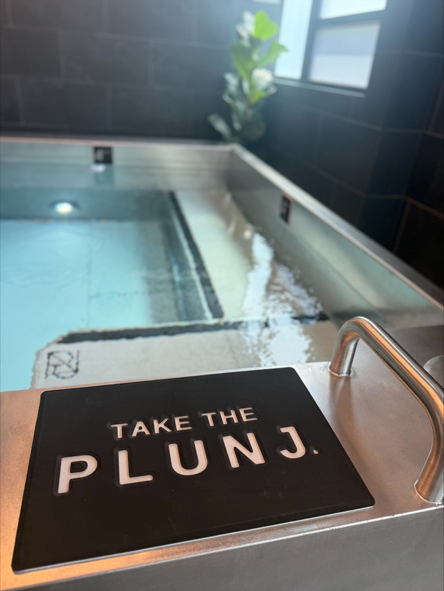 Take the PLUNJ sign at the PLUNJ Logan cold plunge